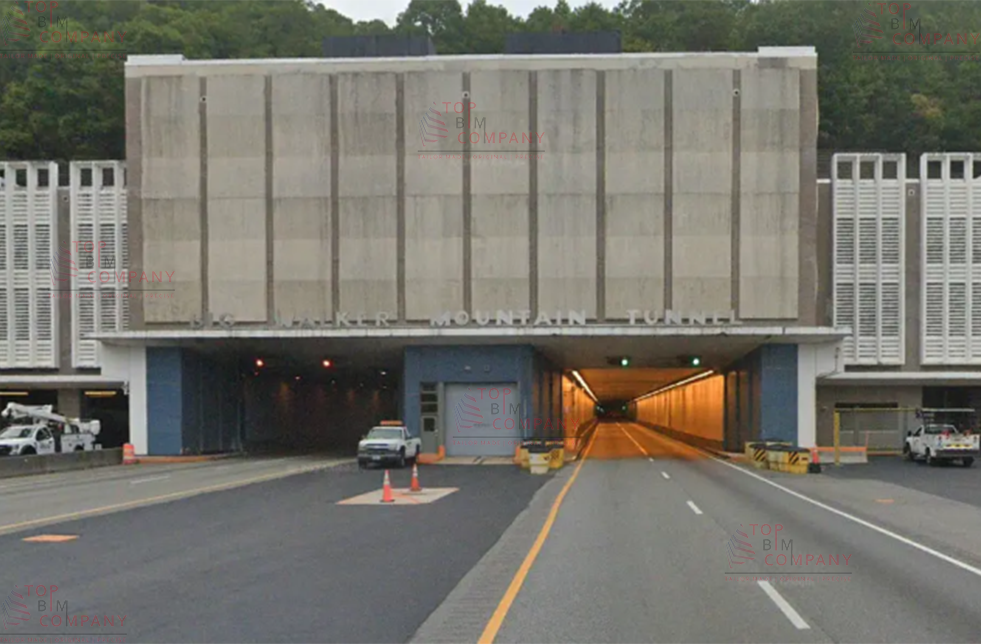 Front view of the Big Walker Mountain Tunnel in Virginia, showing the tunnel entrance with traffic cones and vehicles nearby. The image relates to a Scan-to-BIM project for the Virginia Department of Transportation involving tunnel renovations, roadway infrastructure, utility systems, and portal buildings, supported by detailed BIM modeling and as-built documentation.